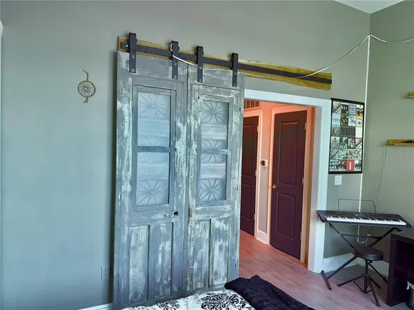 a bathroom with a shower and a sink