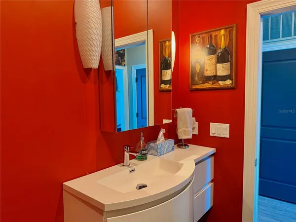 a bathroom with a sink and a mirror