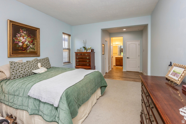 11751 Lake Run Road South Jordan, UT 84009 - Photo 16 of 38 Carpeted bedroom featuring light blue walls and a window with horizontal blinds