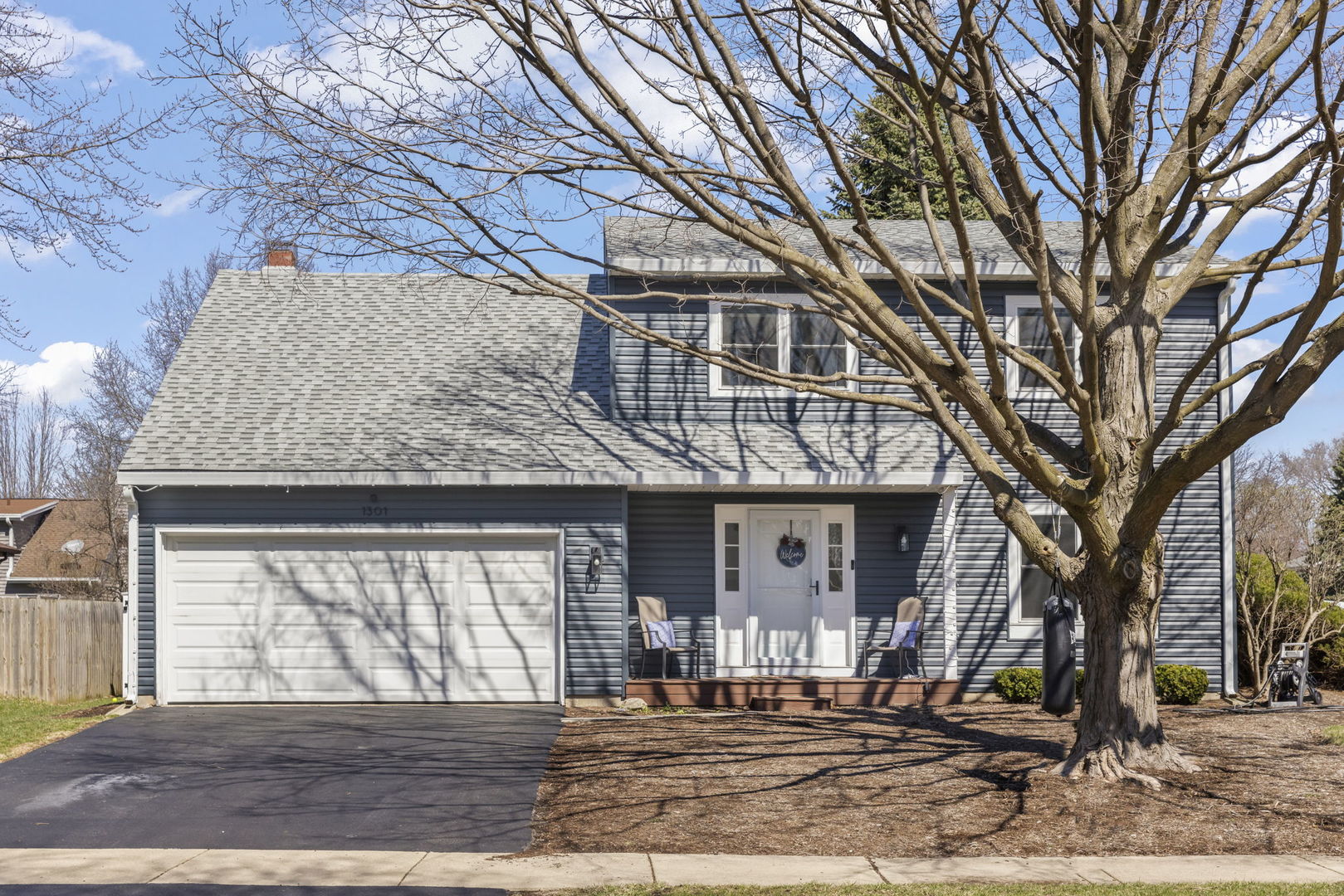 1301 Peshtigo Avenue Naperville, IL 60564 - Photo 1 of 30 a front view of a house with a yard