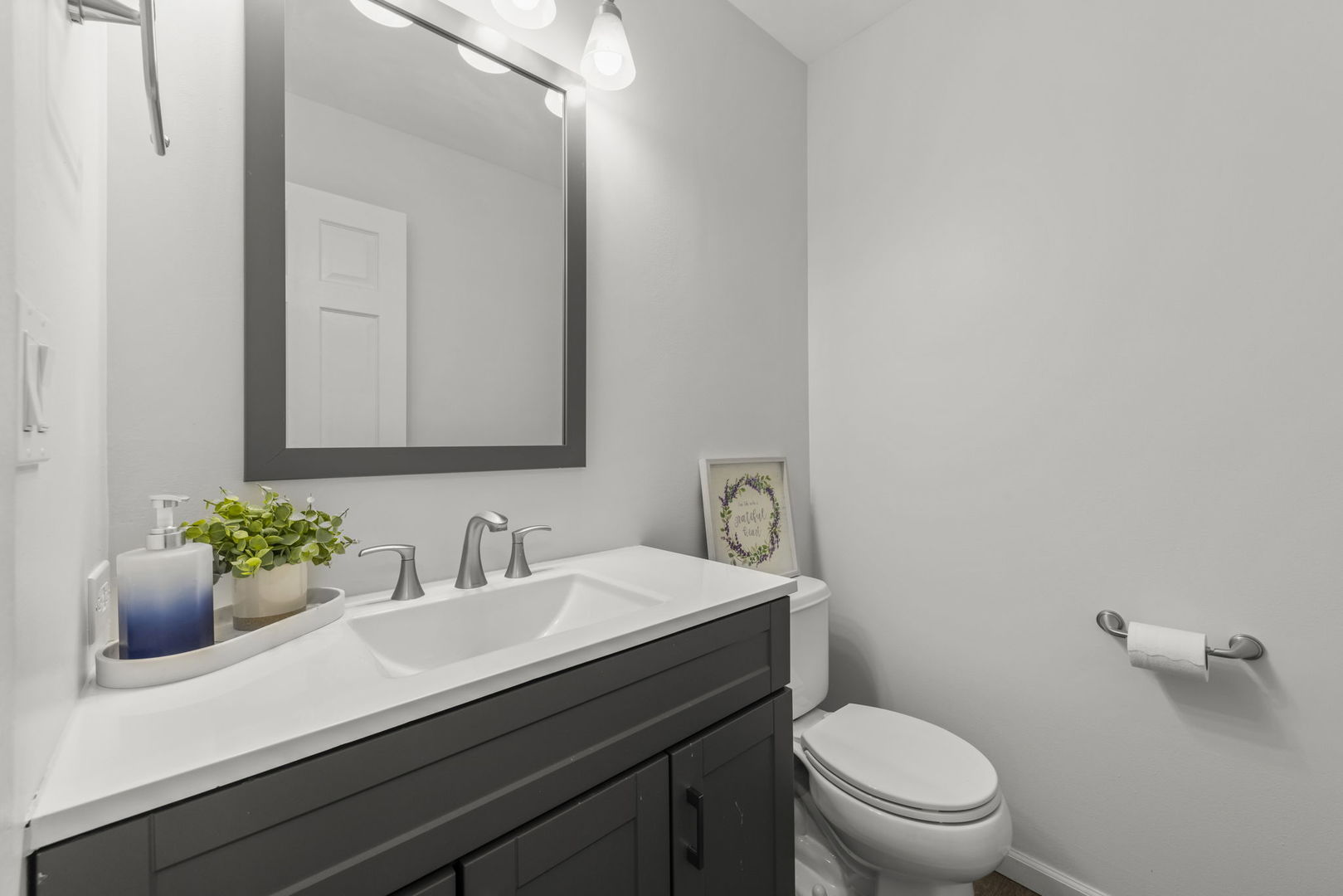 1301 Peshtigo Avenue Naperville, IL 60564 - Photo 11 of 30 a bathroom with a sink toilet and a mirror