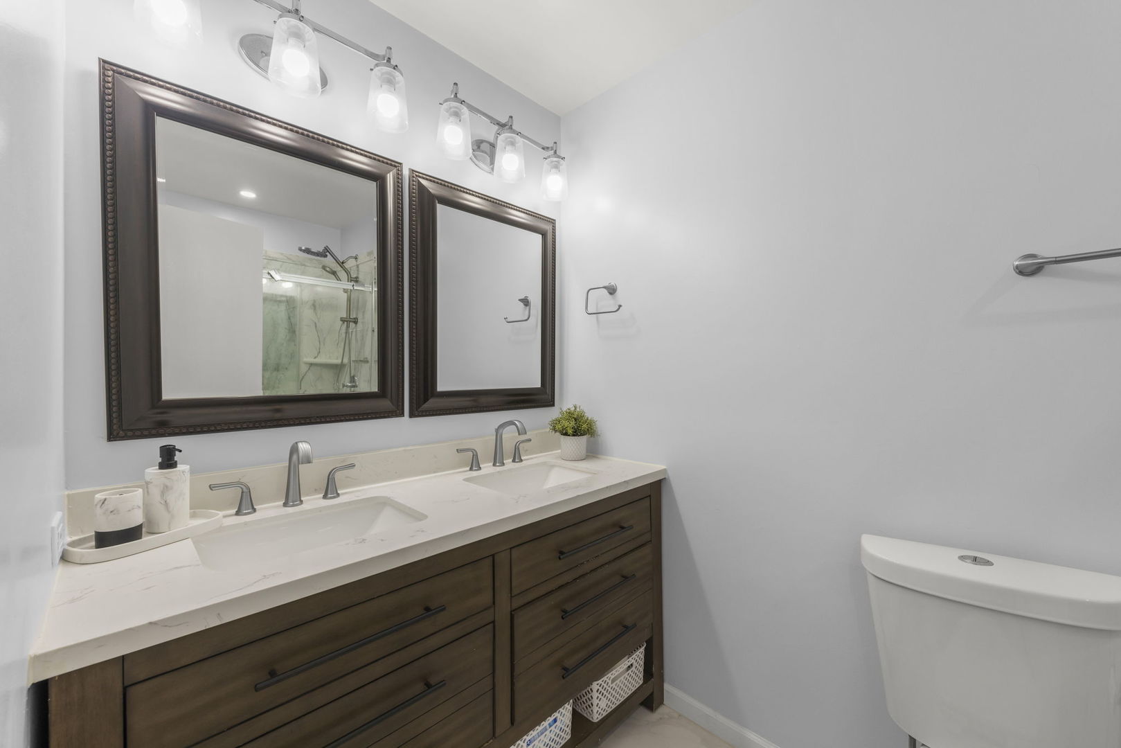 1301 Peshtigo Avenue Naperville, IL 60564 - Photo 14 of 30 a bathroom with a double vanity sink and a mirror