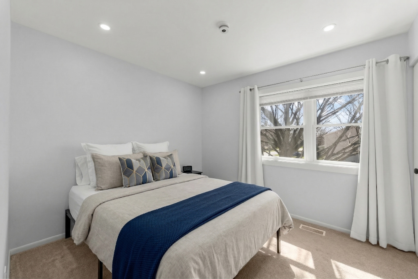 1301 Peshtigo Avenue Naperville, IL 60564 - Photo 16 of 30 a bedroom with a large bed and a window