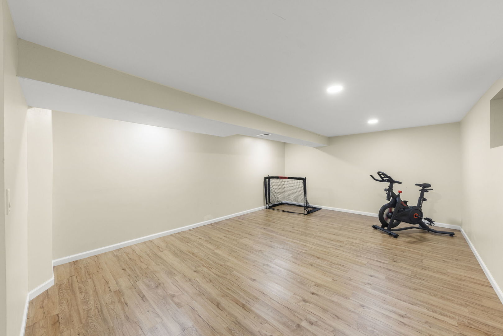 1301 Peshtigo Avenue Naperville, IL 60564 - Photo 23 of 30 a view of a room with gym equipment and wooden floor
