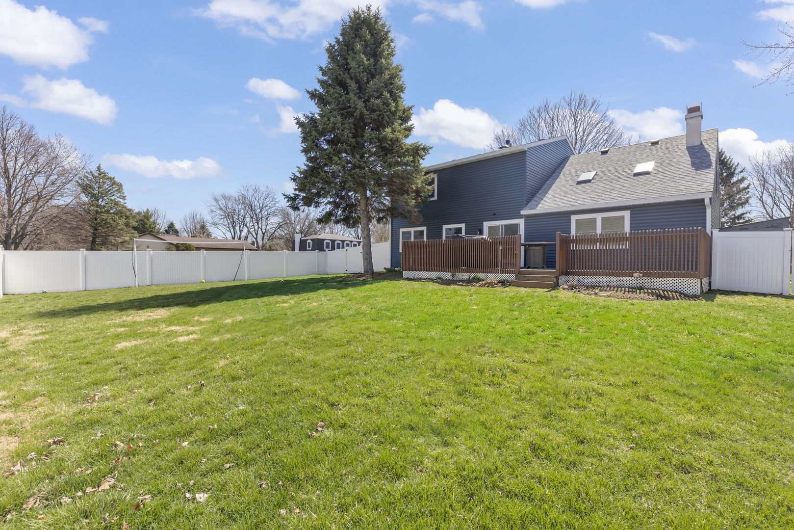 1301 Peshtigo Avenue Naperville, IL 60564 - Photo 26 of 30 a view of a house with a big yard and a large tree