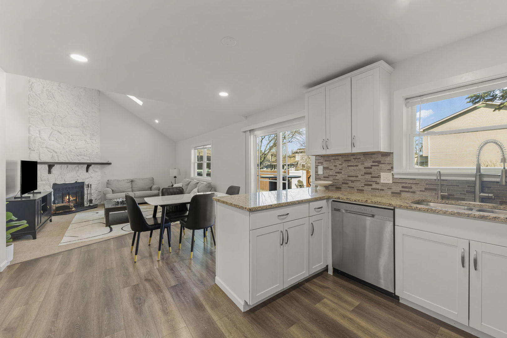 1301 Peshtigo Avenue Naperville, IL 60564 - Photo 5 of 30 a kitchen with lots of counter top space and dining table