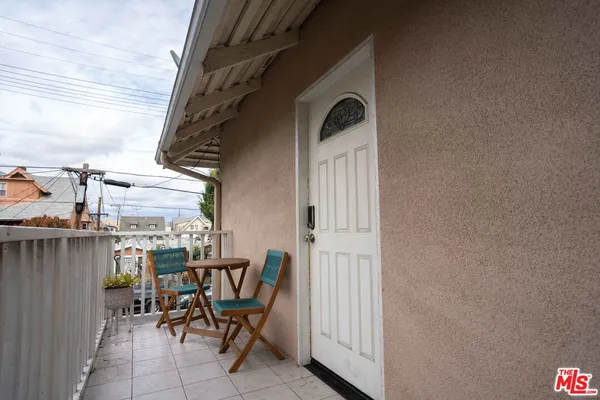 a view of balcony with furniture