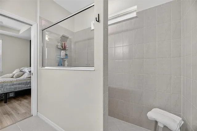a bathroom with a granite countertop sink a toilet and a mirror