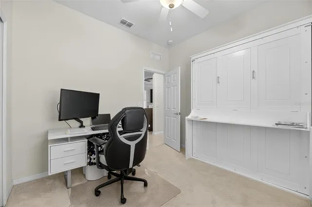 a view of a workspace with furniture and toys