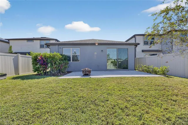 a view of a house with a yard and a garden