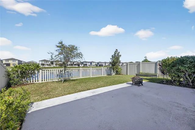 a view of a lake with houses in the back