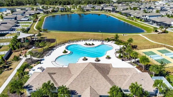 an aerial view of a house with a swimming pool