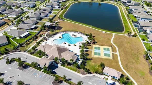 an aerial view of a swimming pool and outdoor space