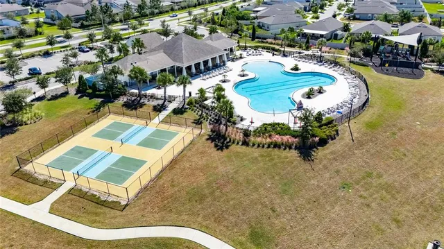 an aerial view of a house with swimming pool