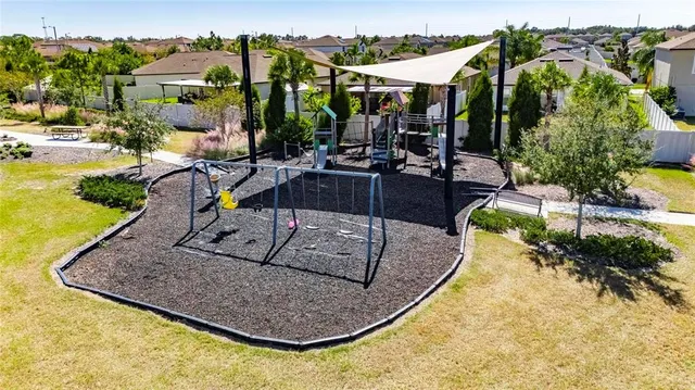 a view of a swimming pool with outdoor seating