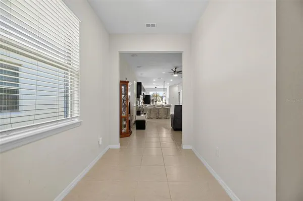 a view of a living room with a white car parked