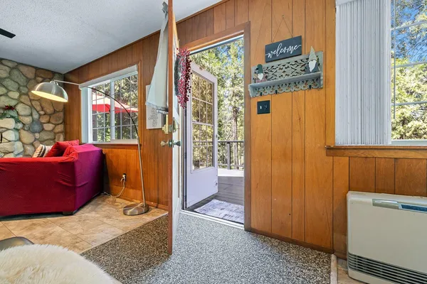a view of a dining room with furniture window and outside view