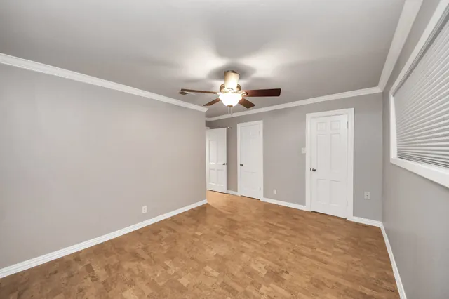 a view of a livingroom with a chandelier fan