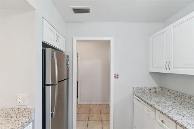 a dining room with furniture garden view and a chandelier