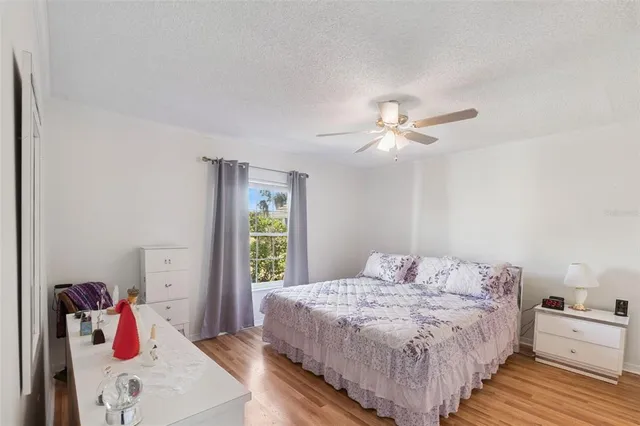 a bathroom with a granite countertop sink mirror and a bathtub