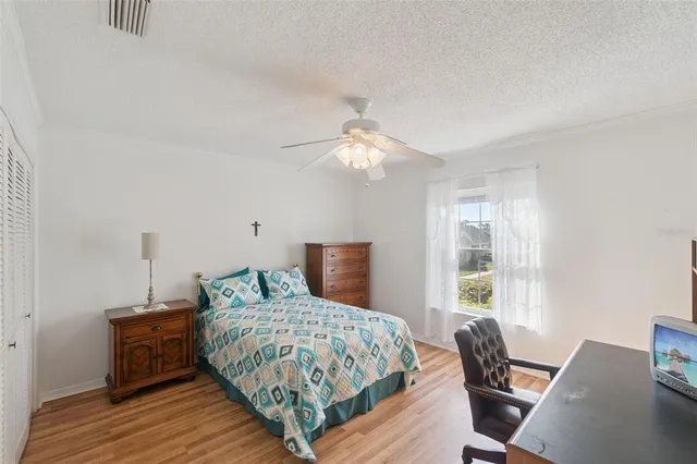 a view of a balcony dining table and a potted plant