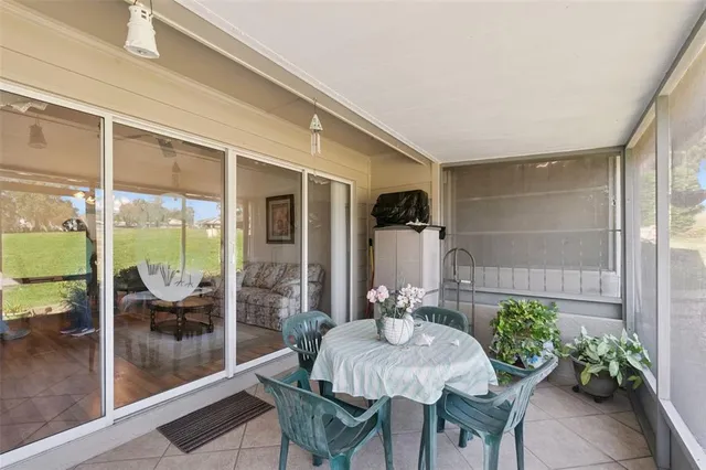 a view of a house with a yard and sitting area
