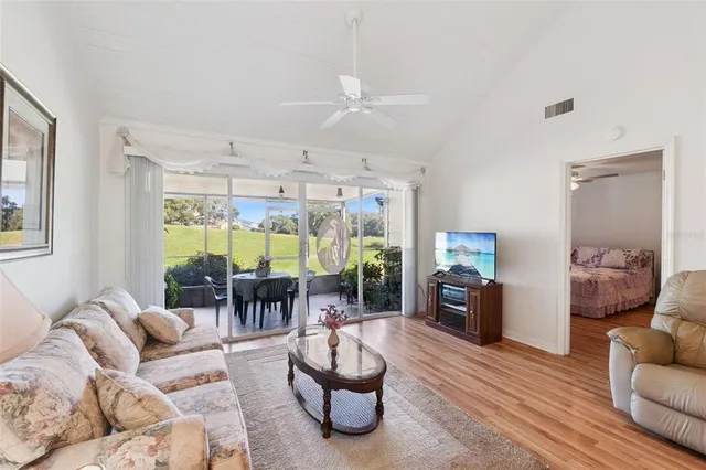 a view of a hallway with closet and furniture