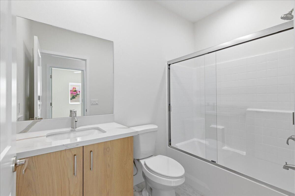 68160 Modalo Road Cathedral City, CA 92234 - Photo 24 of 57 a bathroom with a granite countertop sink toilet and shower