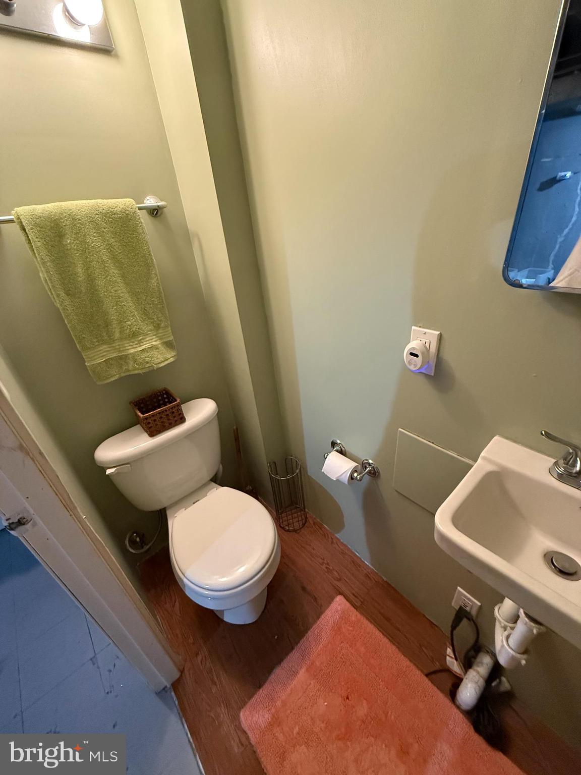 2235 Hawthorne Road Baltimore, MD 21220 - Photo 25 of 35 a bathroom with a sink and a toilet