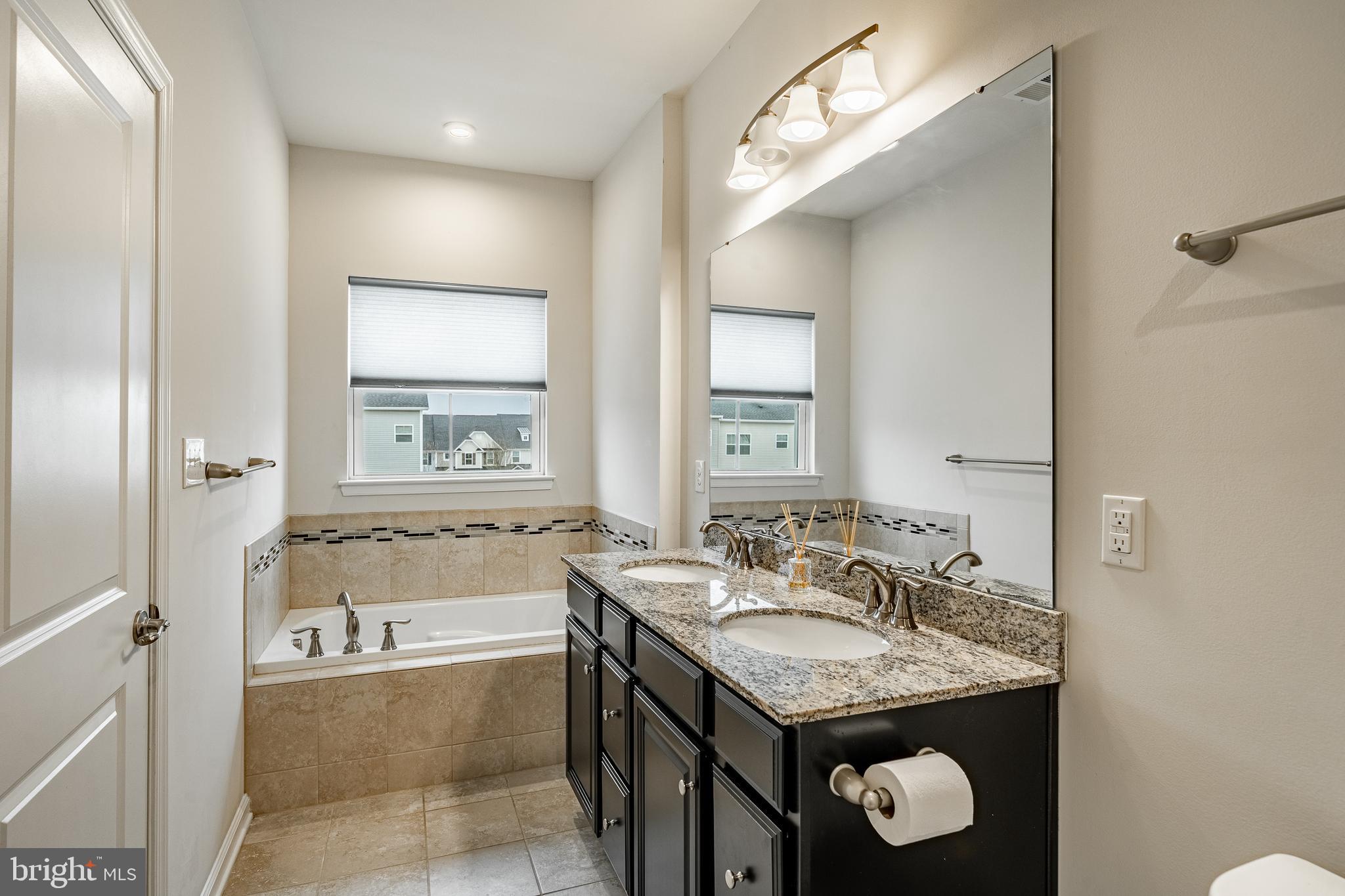 300 Blue Welsh Street Malvern, PA 19355 - Photo 26 of 37 a bathroom with a granite countertop sink and a mirror