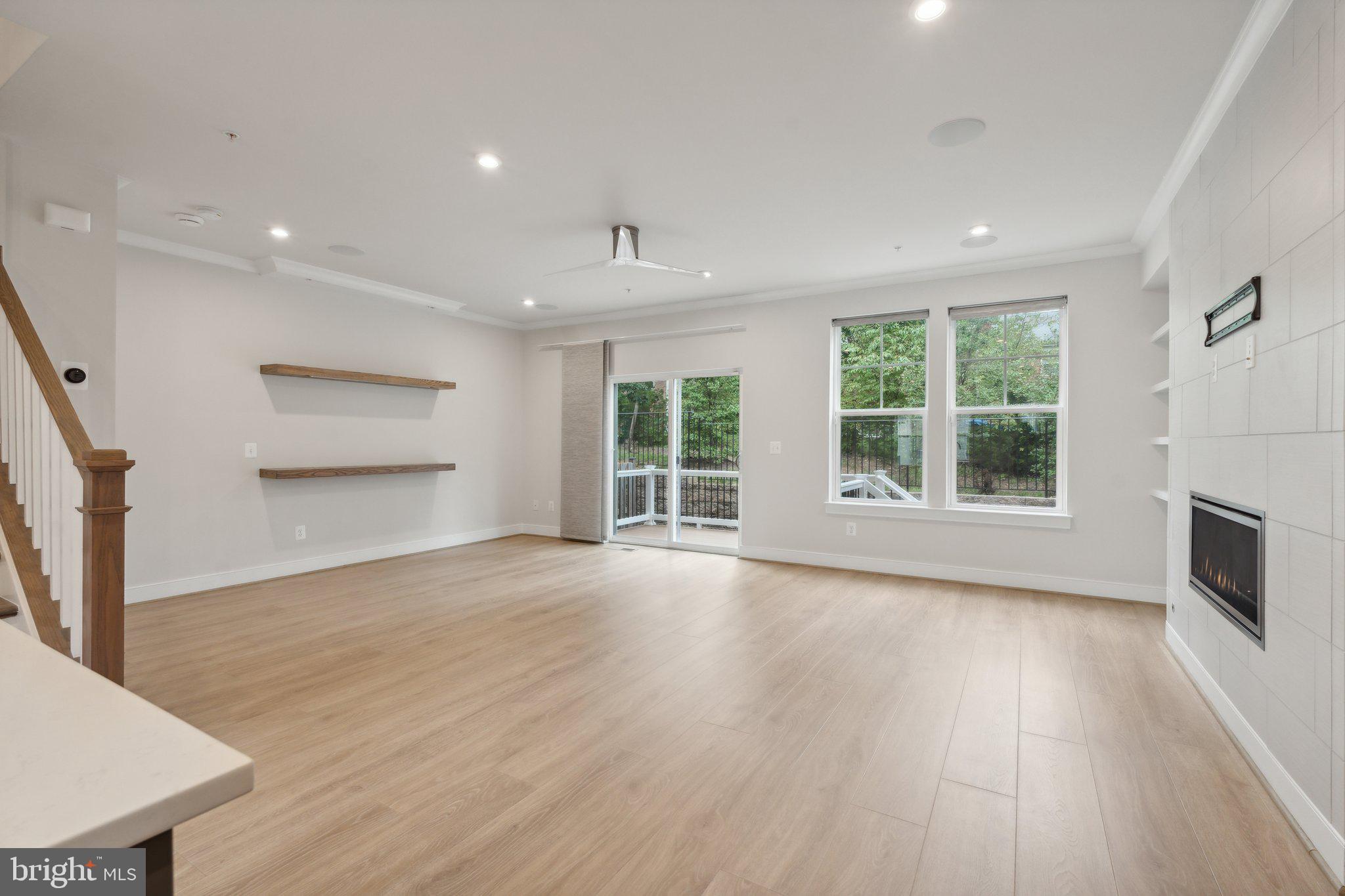 3034 Declan Way Falls Church, VA 22044 - Photo 13 of 41 a view of a room with wooden floor fireplace and windows