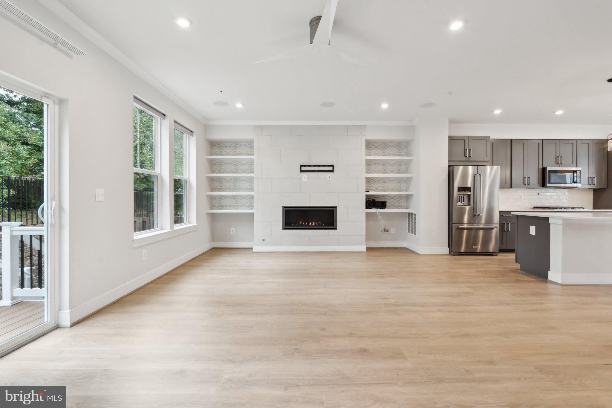 3034 Declan Way Falls Church, VA 22044 - Photo 14 of 41 a view of an empty room with a kitchen and a window