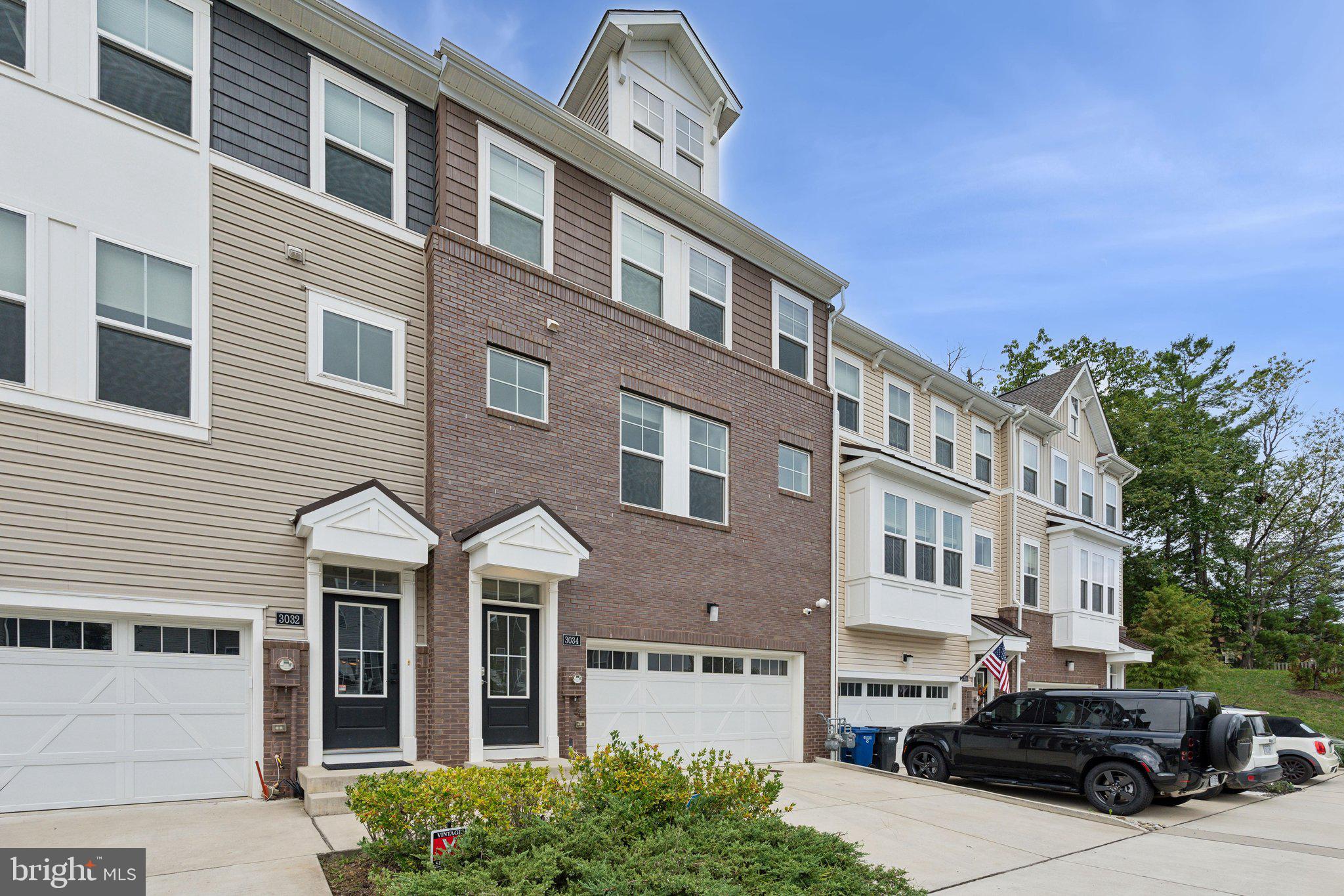 3034 Declan Way Falls Church, VA 22044 - Photo 3 of 41 a front view of a building with lot of cars and trees