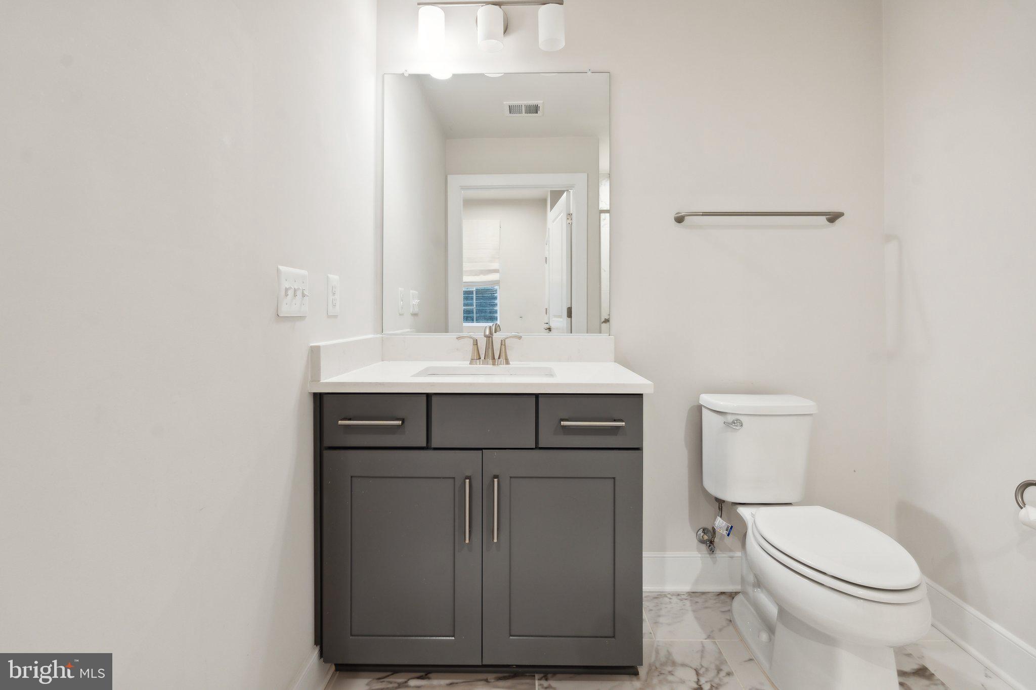 3034 Declan Way Falls Church, VA 22044 - Photo 41 of 41 a bathroom with a sink vanity and a toilet