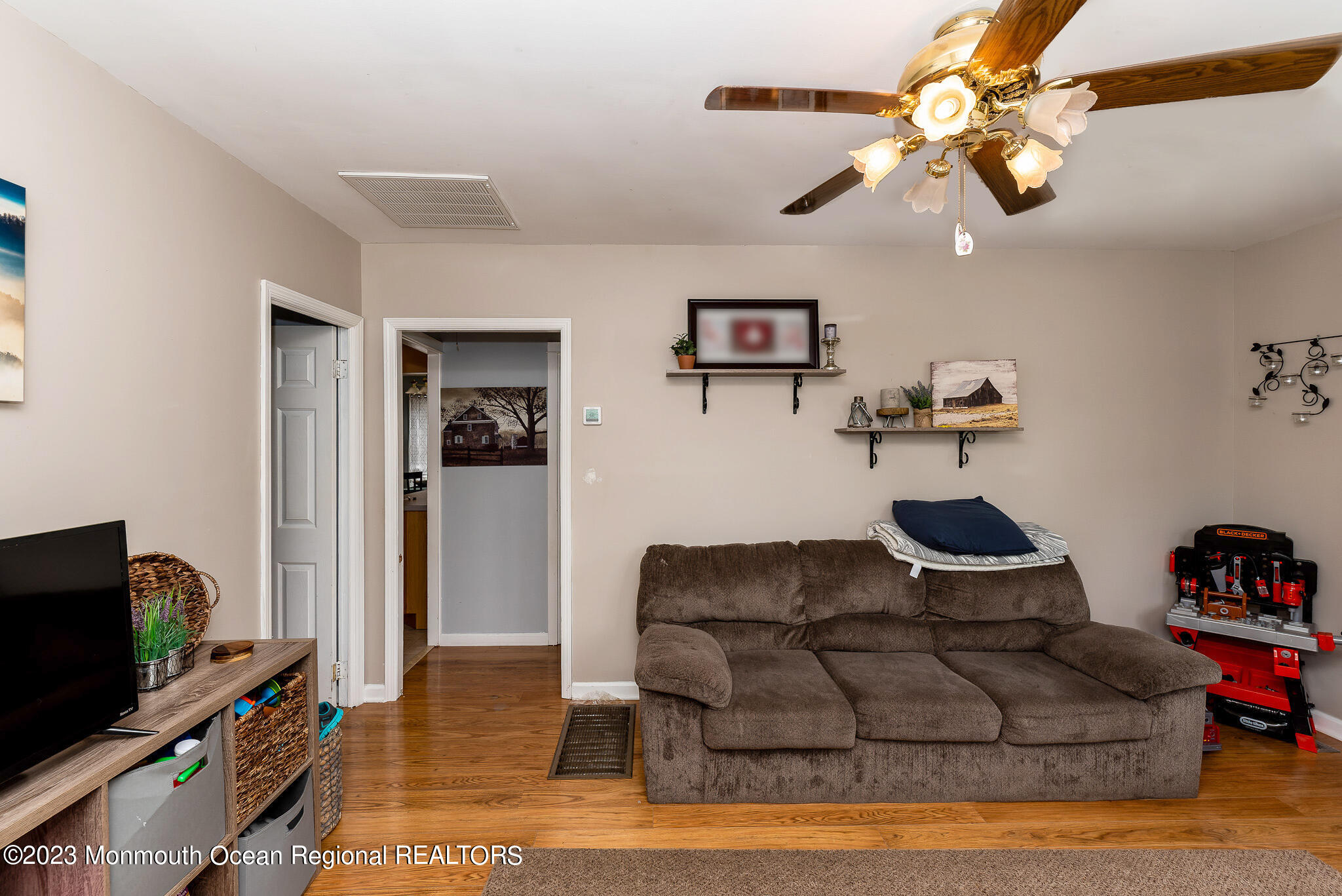 1520 Whitcomb Road Forked River, NJ 08731 - Photo 8 of 31 a living room with furniture and a flat screen tv