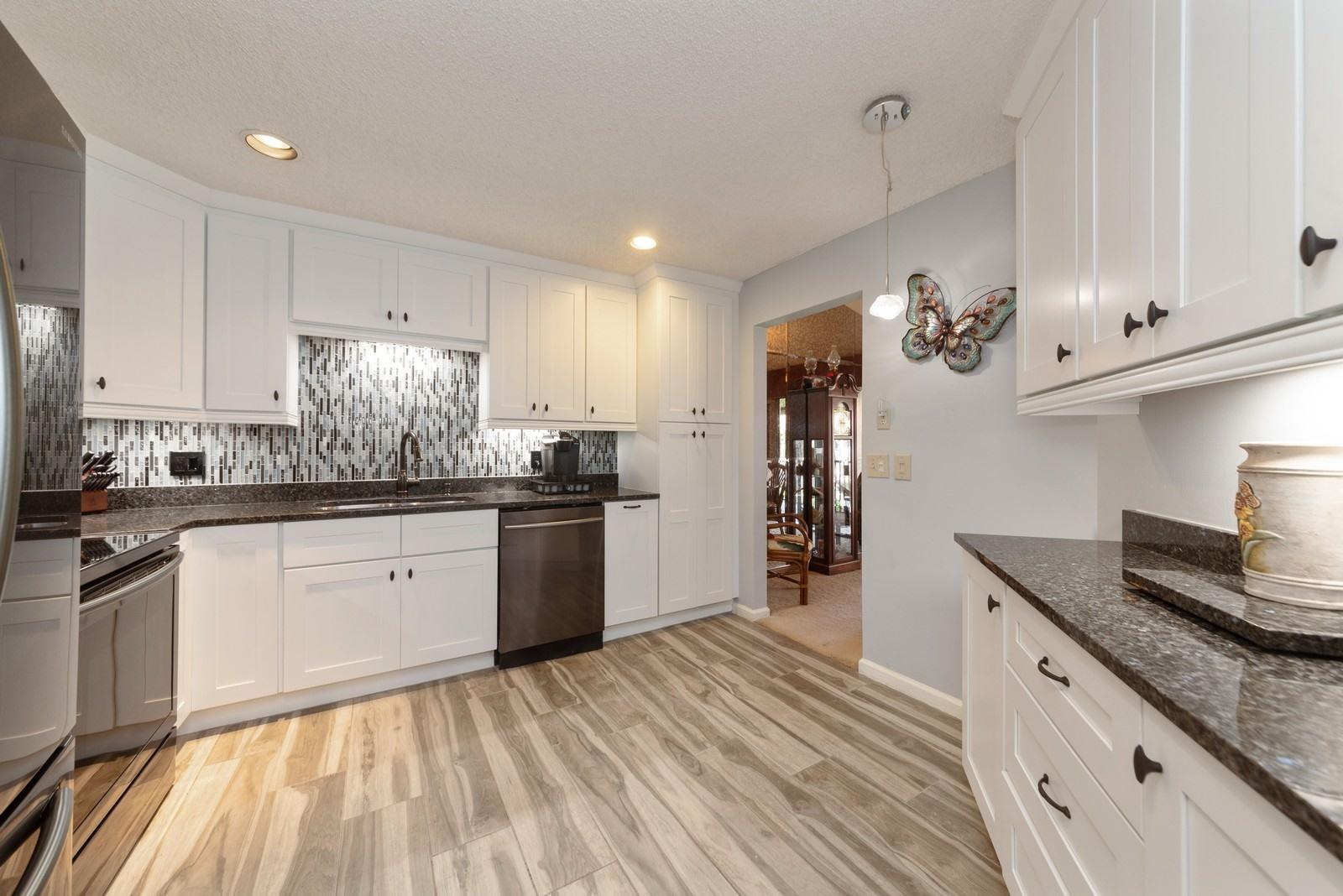 5710 Coach House Circle, Unit F Boca Raton, FL 33486 - Photo 1 of 18 05_5710CoachHouseCircleF_5_Kitchen_Custo
