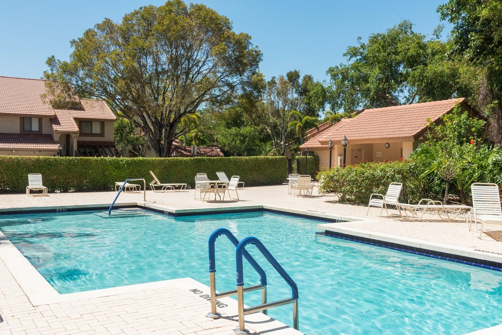 5710 Coach House Circle, Unit F Boca Raton, FL 33486 - Photo 16 of 18 16_5710CoachHouseCircleF_29003_Pool_Cust