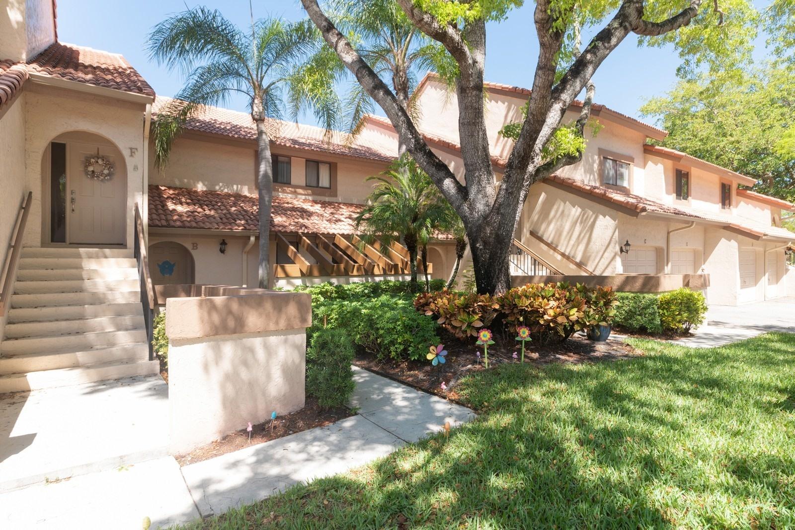 5710 Coach House Circle, Unit F Boca Raton, FL 33486 - Photo 3 of 18 01_5710CoachHouseCircleF_300_FrontView_C