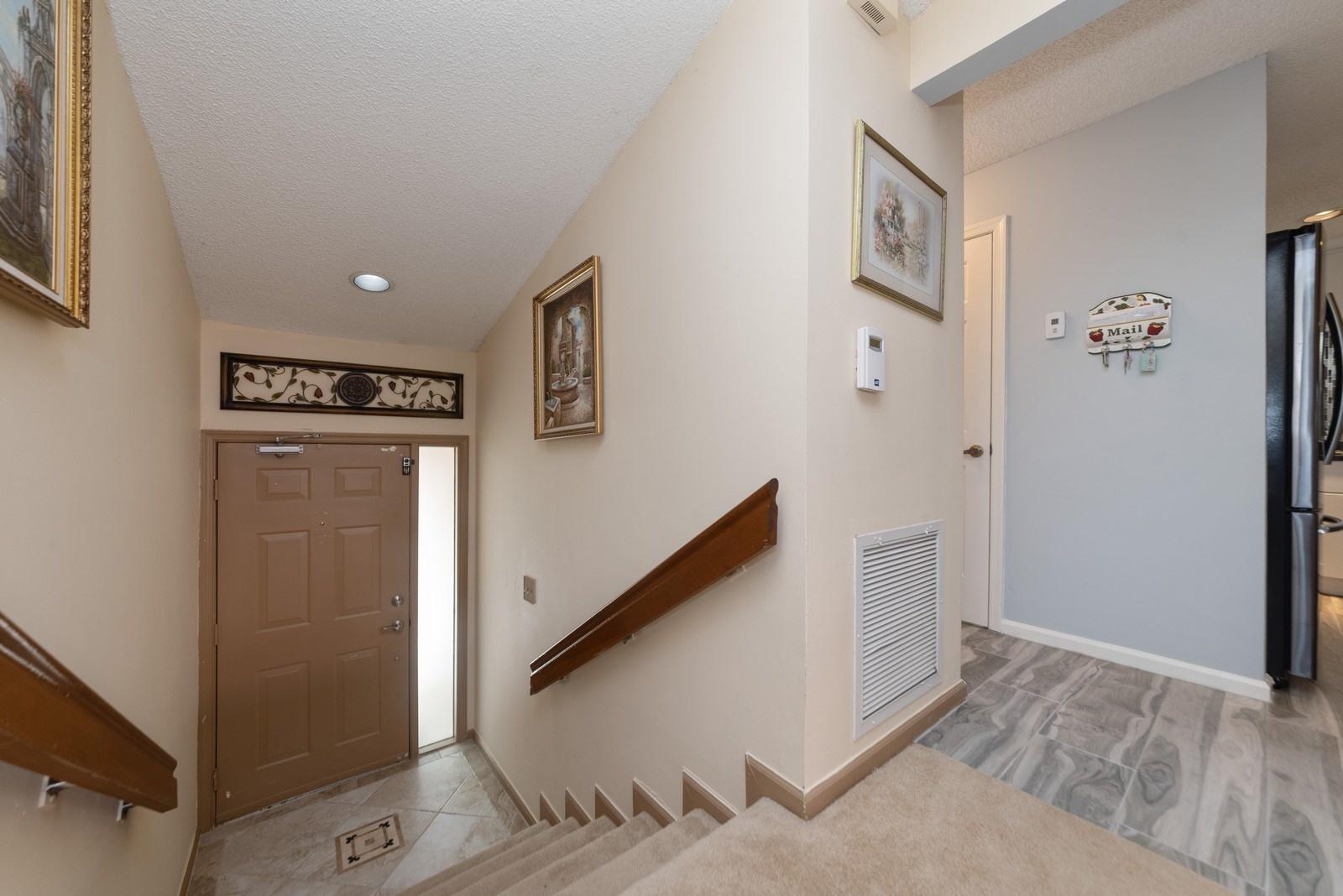 5710 Coach House Circle, Unit F Boca Raton, FL 33486 - Photo 5 of 18 03_5710CoachHouseCircleF_32_Foyer_Custom