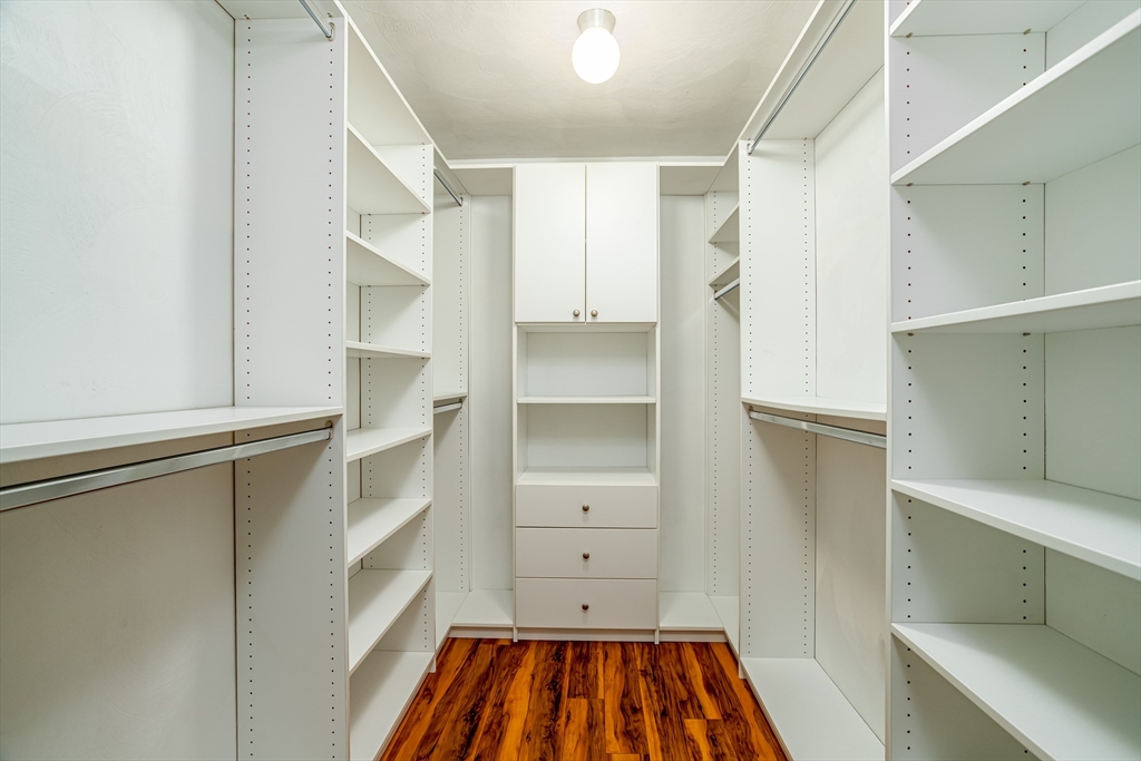 115 Ridgefield Circle, Unit D Clinton, MA 01510 - Photo 16 of 29 a view of walk in closet with empty racks