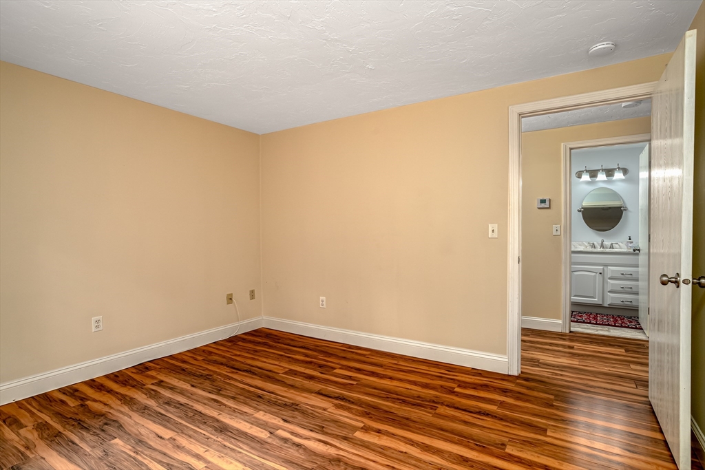 115 Ridgefield Circle, Unit D Clinton, MA 01510 - Photo 19 of 29 wooden floor in an empty room