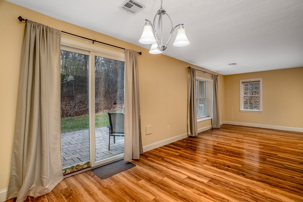 115 Ridgefield Circle, Unit D Clinton, MA 01510 - Photo 9 of 29 a view of a livingroom with wooden floor and windows