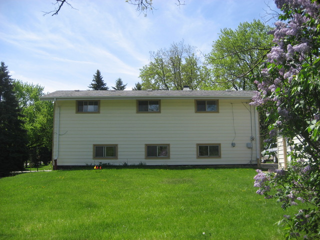 582 Riedy Road Lisle, IL 60532 - Photo 8 of 23 a view of a house with a yard