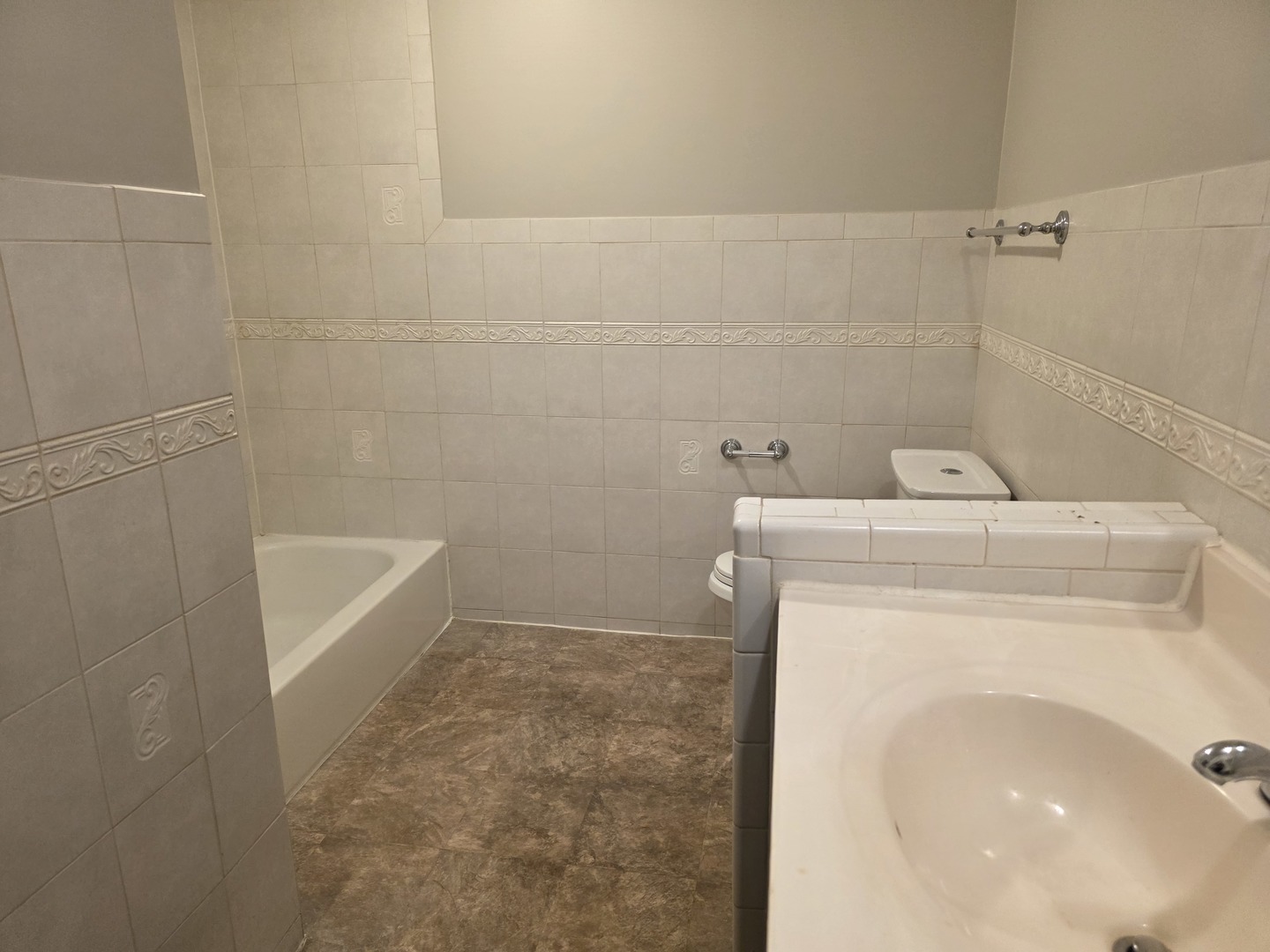 9-s110 S Frontage Road, Unit 205 Darien, IL 60527 - Photo 6 of 7 a bathroom with a sink and a vanity