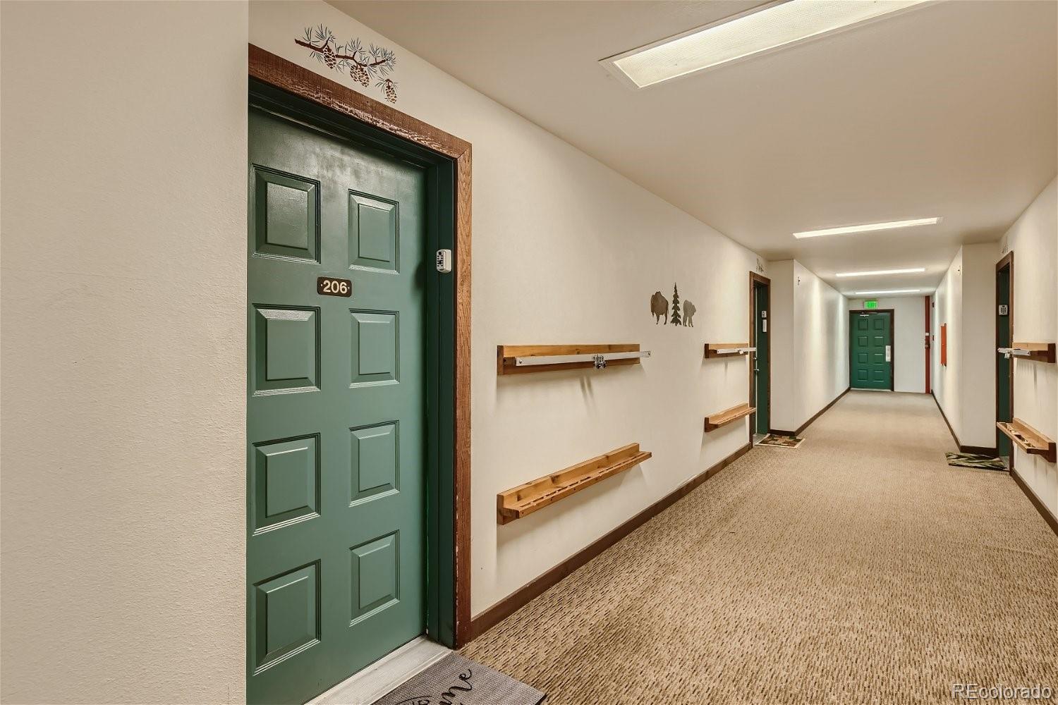 89100 Ryan Gulch Road, Unit 206 Silverthorne, CO 80498 - Photo 11 of 17 a view of a hallway with staircase