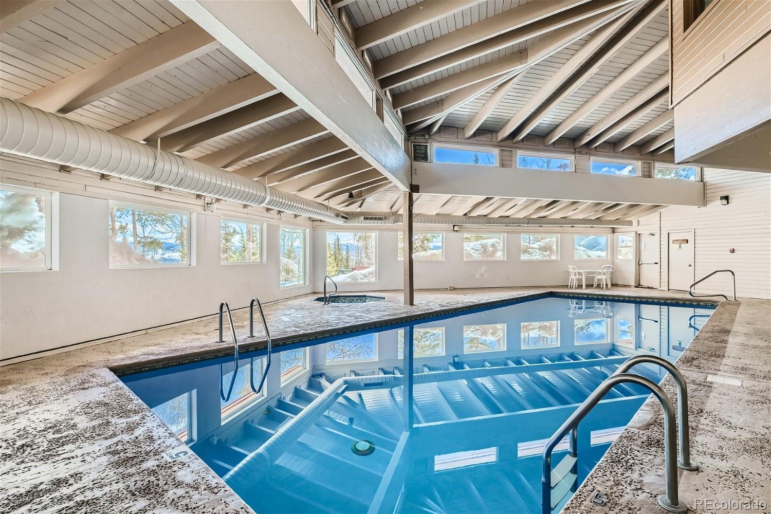 89100 Ryan Gulch Road, Unit 206 Silverthorne, CO 80498 - Photo 10 of 17 a view of a hallway with wooden floor