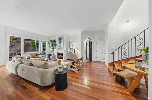 a living room with furniture or couch and a fireplace