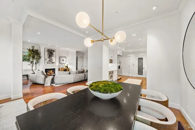 a living room with furniture a window and a chandelier