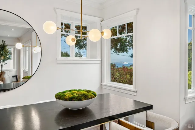 a kitchen with a stove and white cabinets