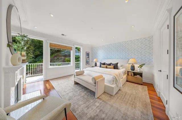 a balcony with wooden floor and outdoor seating